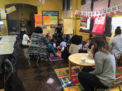 Librarian Kayla Hoskinson shares stories with Dunbar kindergarteners and teachers. 